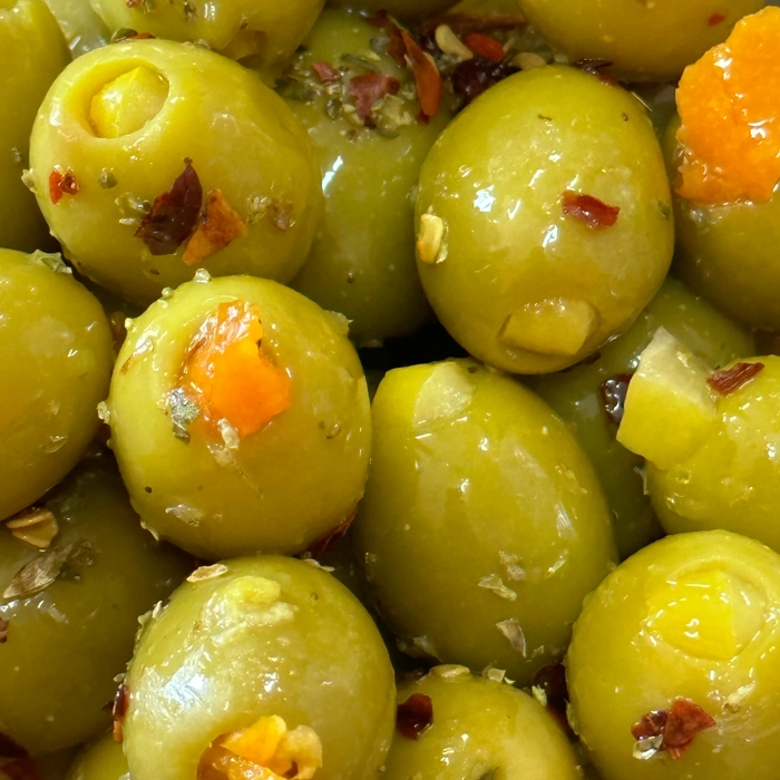 Green olives stuffed with orange in oil